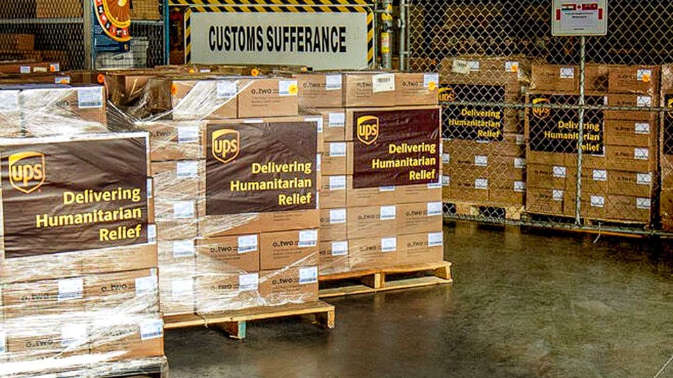 Pallets of donated healthcare supplies awaiting customs clearance.