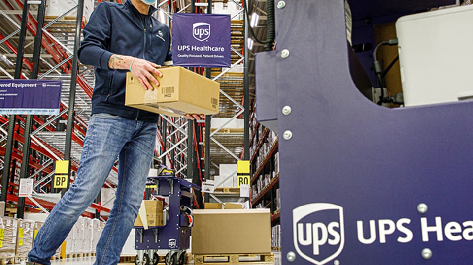 A healthcare employee working in warehouse.