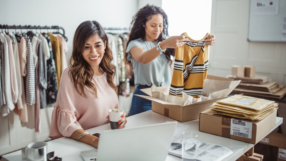 Two ladies working in retail shop