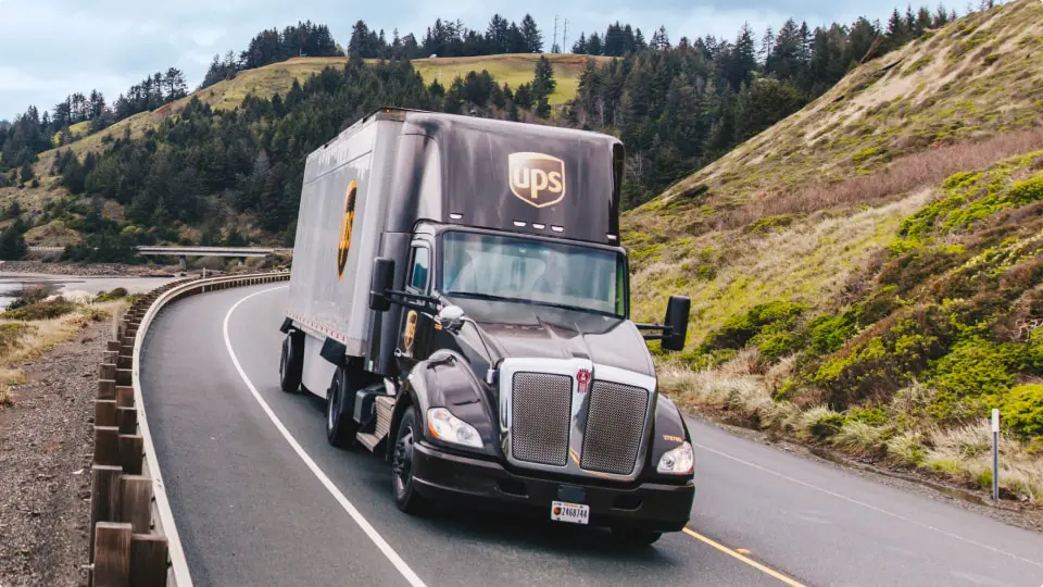 UPS truck driving on curvy road