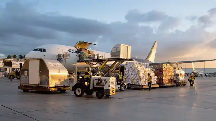 Plane being loaded on a runway