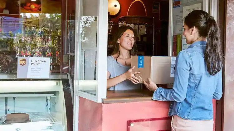 Person at access point collecting a parcel