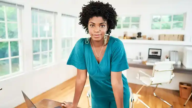 Woman leaning on Desk