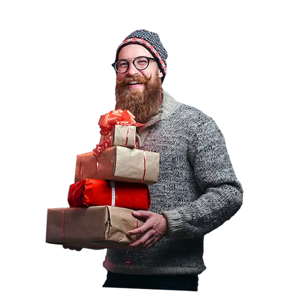 Person in holiday sweater and hat holding packages to ship with U-P-S.