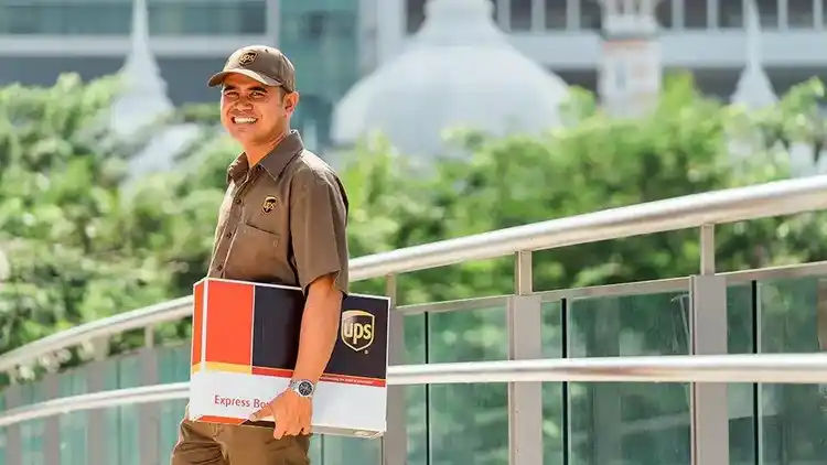 UPS driver with delivery under arm