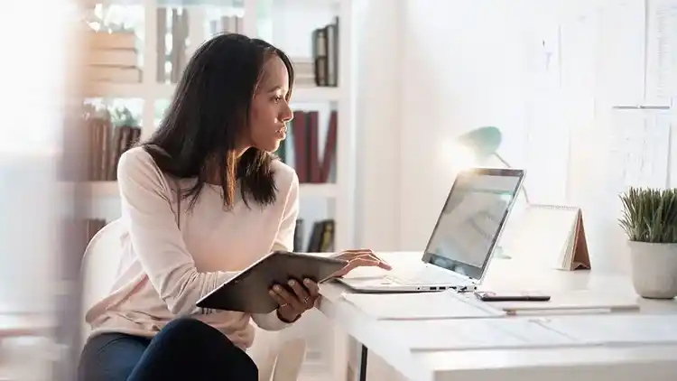 Business woman working on a laptop