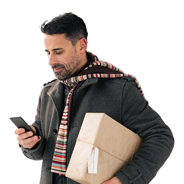 A man looking for UPS locations on mobile while holding a parcel