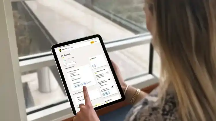 Person looking at their UPS My Choice account on their tablet.