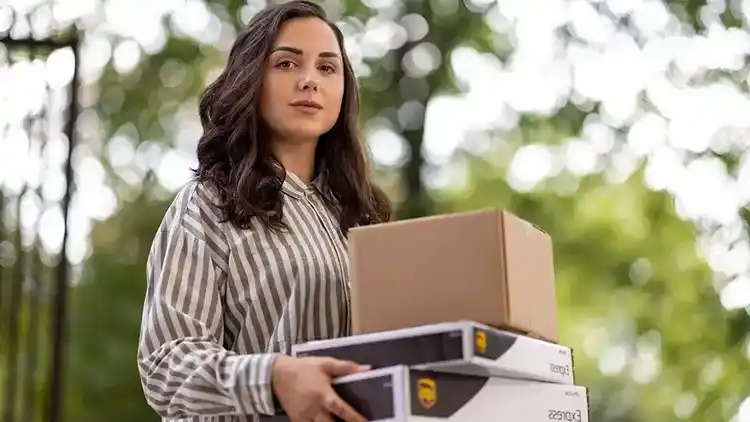 Person holding a UPS box