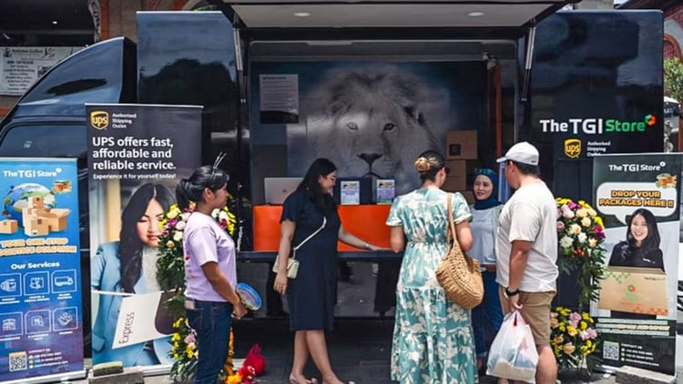 A group of customers outside the U P S mobile store