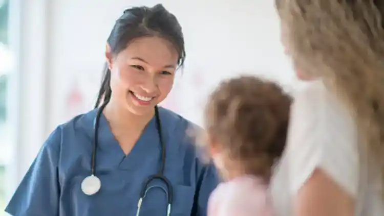 Healthcare worker smiling at a patient