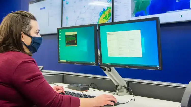 Woman at UPS Command Centre monitoring shipments