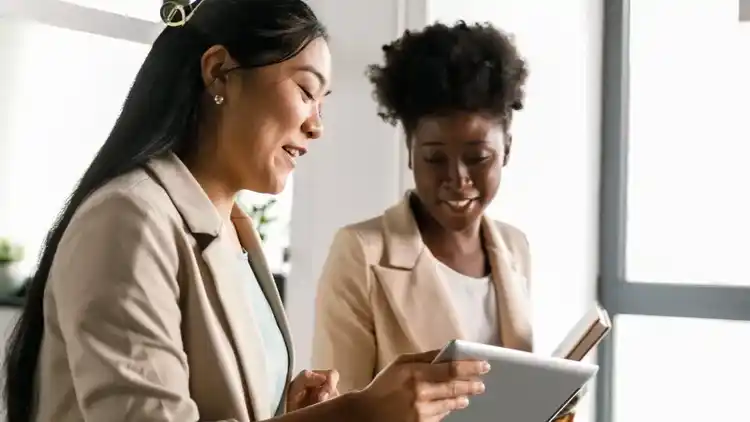 Two Women looking at Tablet