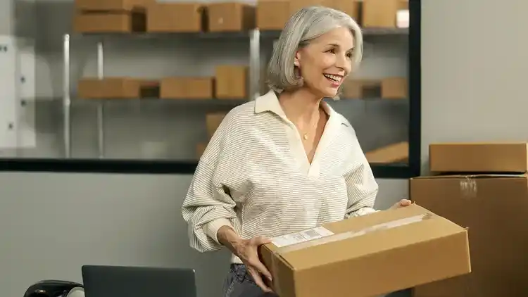 A person holding a package that has been returned to their business.